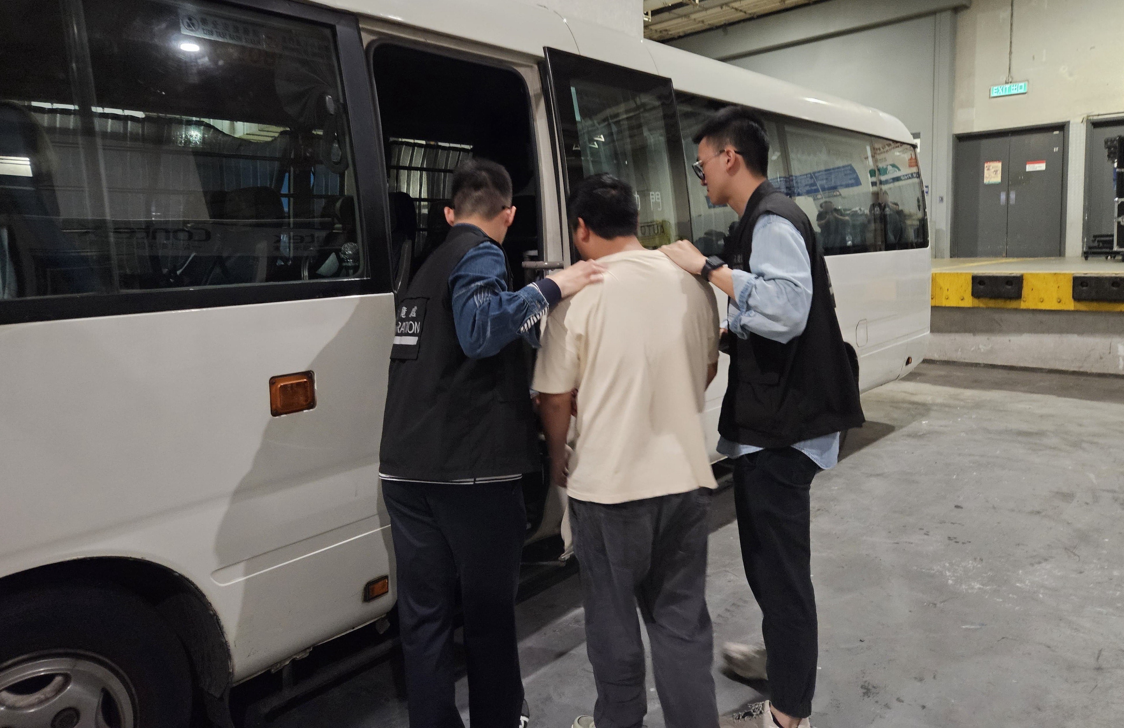 Photo shows a suspected illegal worker arrested during an operation