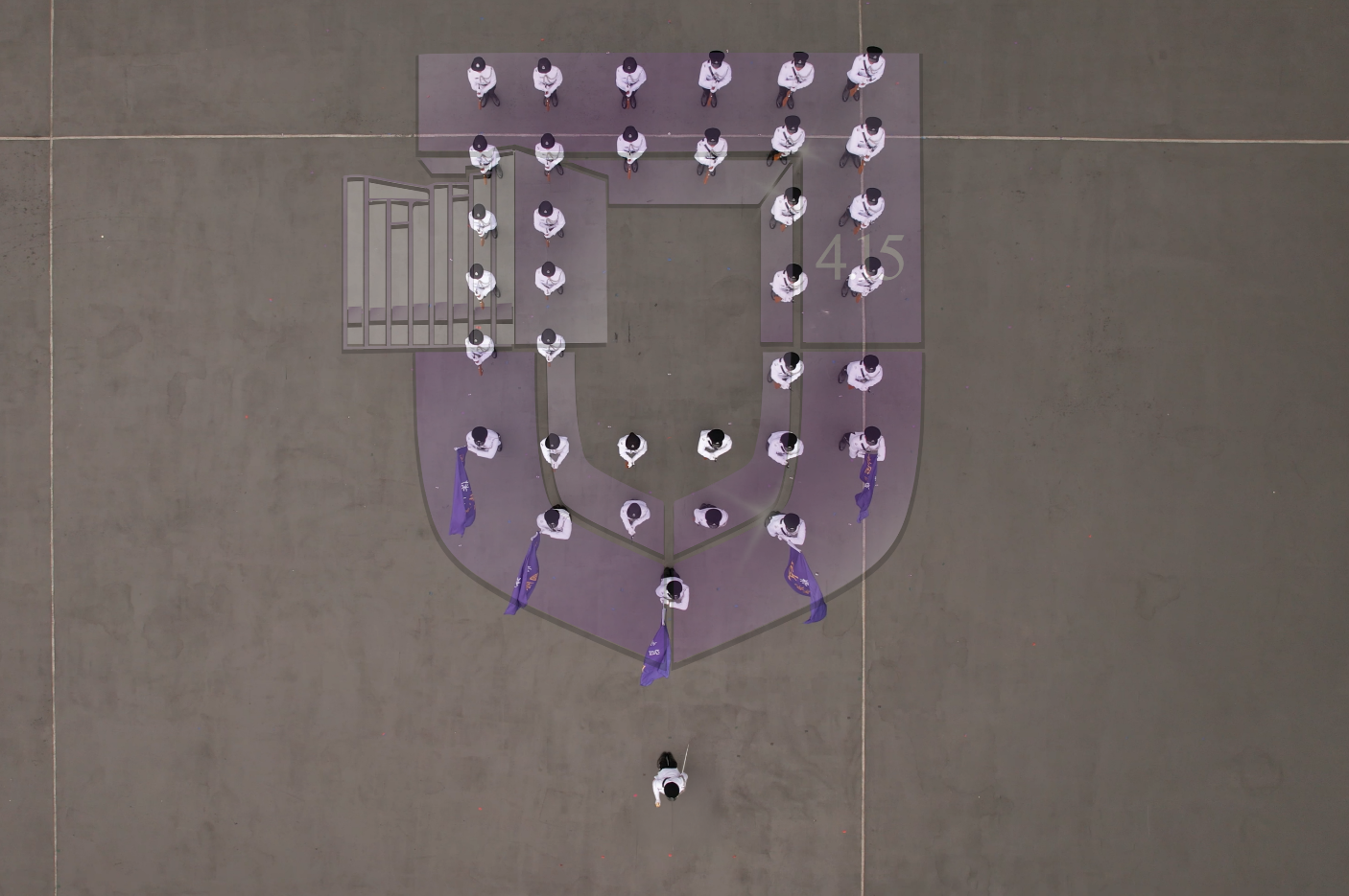 Photo shows the Departmental Contingent forming the logo of the National Security Education Day, symbolising the concerted efforts of the Immigration Department to safeguard the sovereignty, security and development interests of our nation