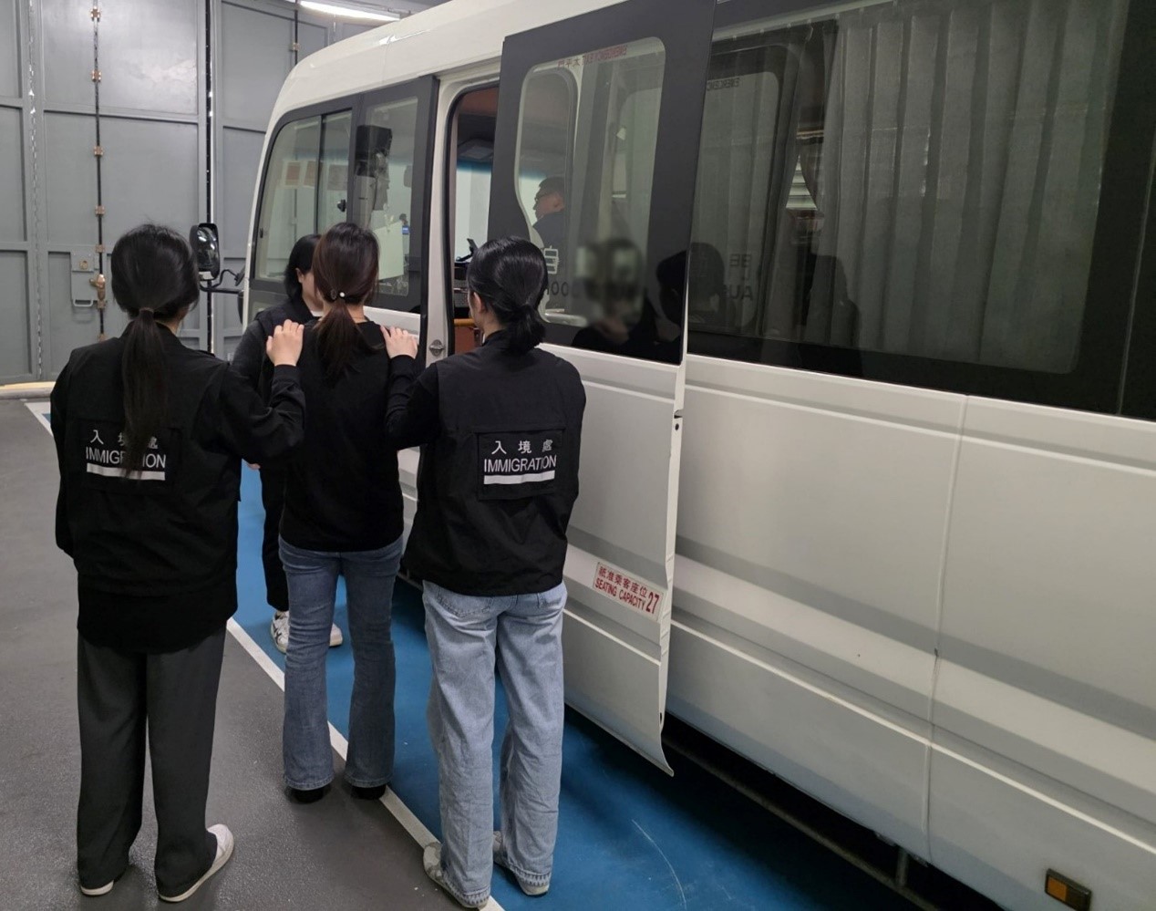 Photo shows a suspected illegal worker arrested during an operation